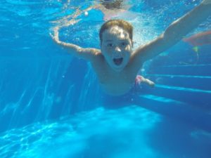 Child swimming in a pool