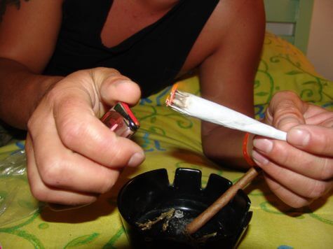 Person lighting a joint