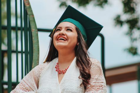 Latino woman celebrates graduating