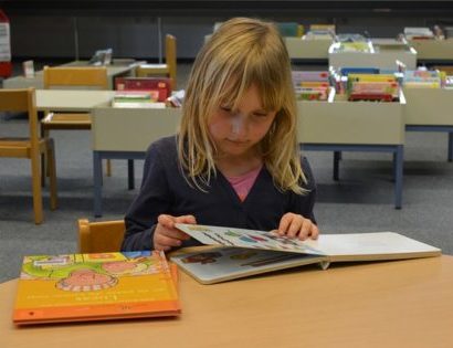 Young girl reading book