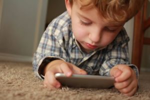 Child playing with smartphone