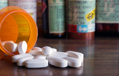 Opioids, medicine bottle with pills