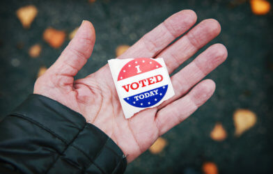 Election Day voting: Person holding "I Voted" sticker