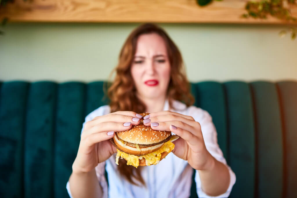 Woman disgusted by burger