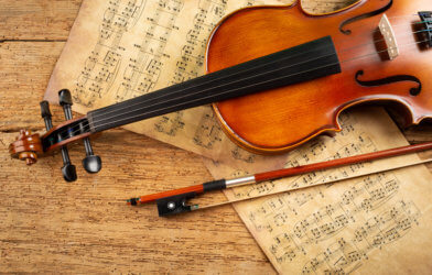 Classical music: violin over musical notes