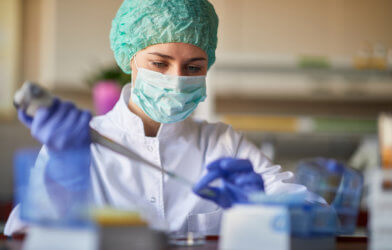 Scientist or lab researcher performing COVID-19 / coronavirus test