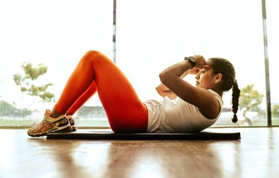 Woman exercising, doing sit-ups