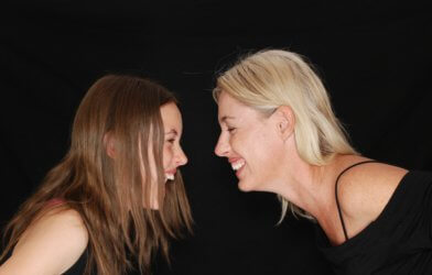 Women laughing at each other