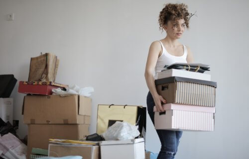 Woman packing for move to new home