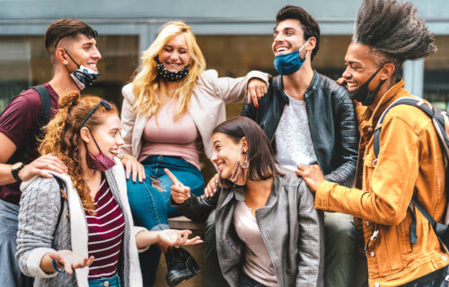 Group of college students hanging out with masks off their face during COVID pandemic