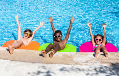Children having summer pool party