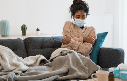 Woman feeling sick with COVID or flu symptoms