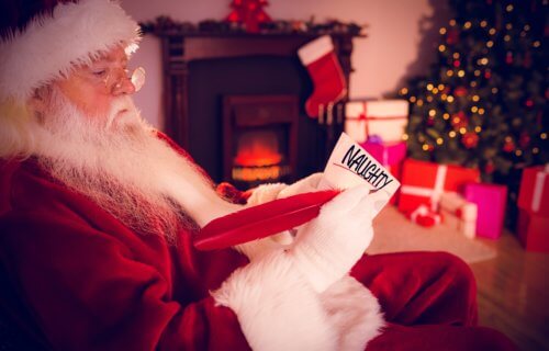 Santa Claus looking at Naughty list