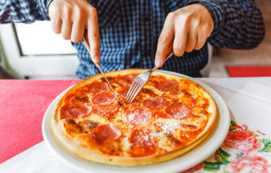 Eating pizza with fork and knife